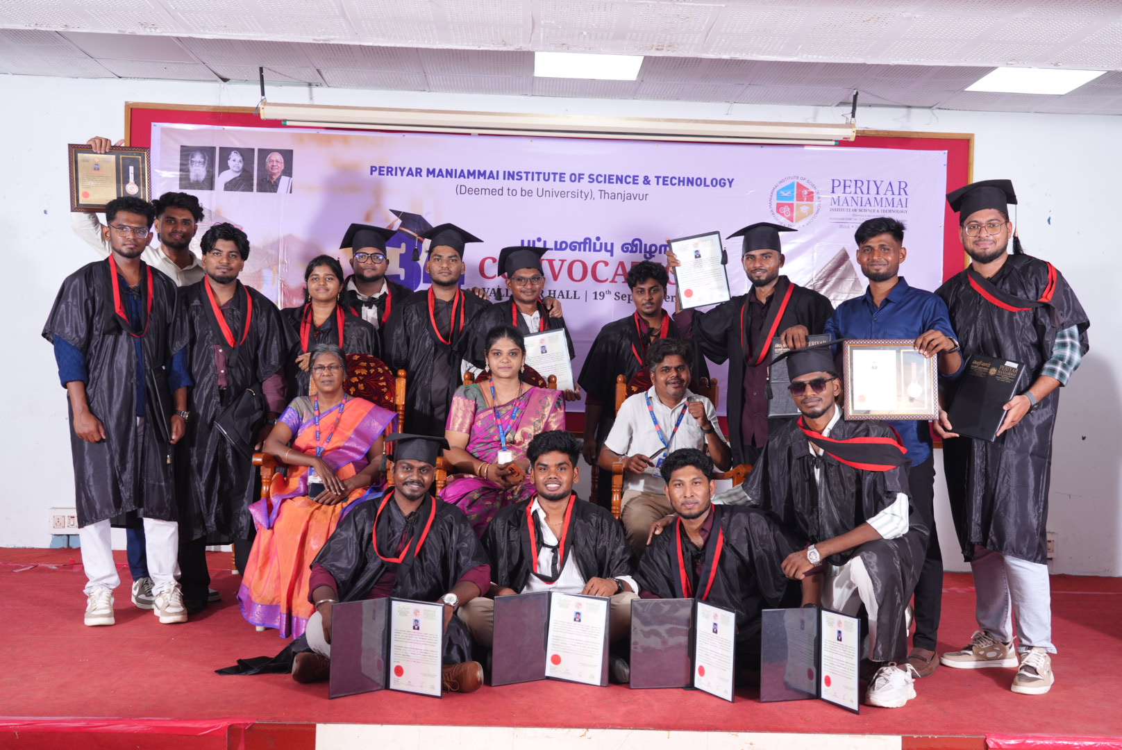 Graduate portrait holding a certificate