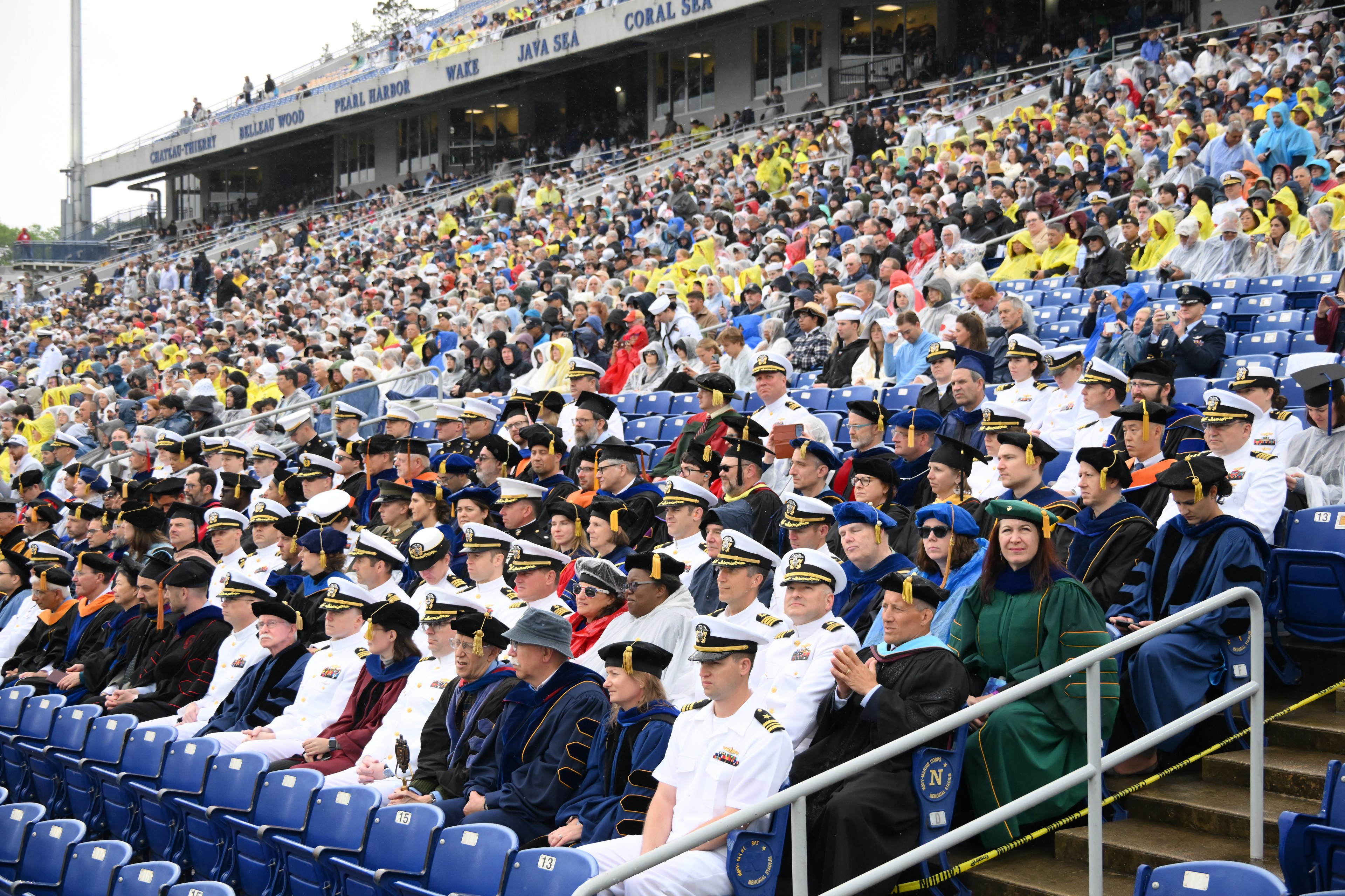 Large audience at a US Naval Academy event photographed by Thornton Studios